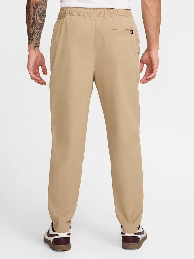 Pantalon tissé fuselé club beige homme - Nike